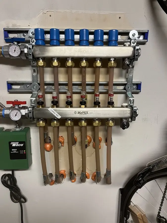 Plumber performing Water Heater Repair at a residential property in Water Valley